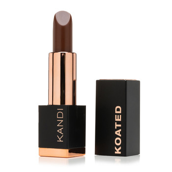 An image of a black and rose gold Suede lipstick tube with the cap standing beside it. The tube reads Kandi and the cap reads Koated. The color is Sweet Brownie, a rich warm dark brown.